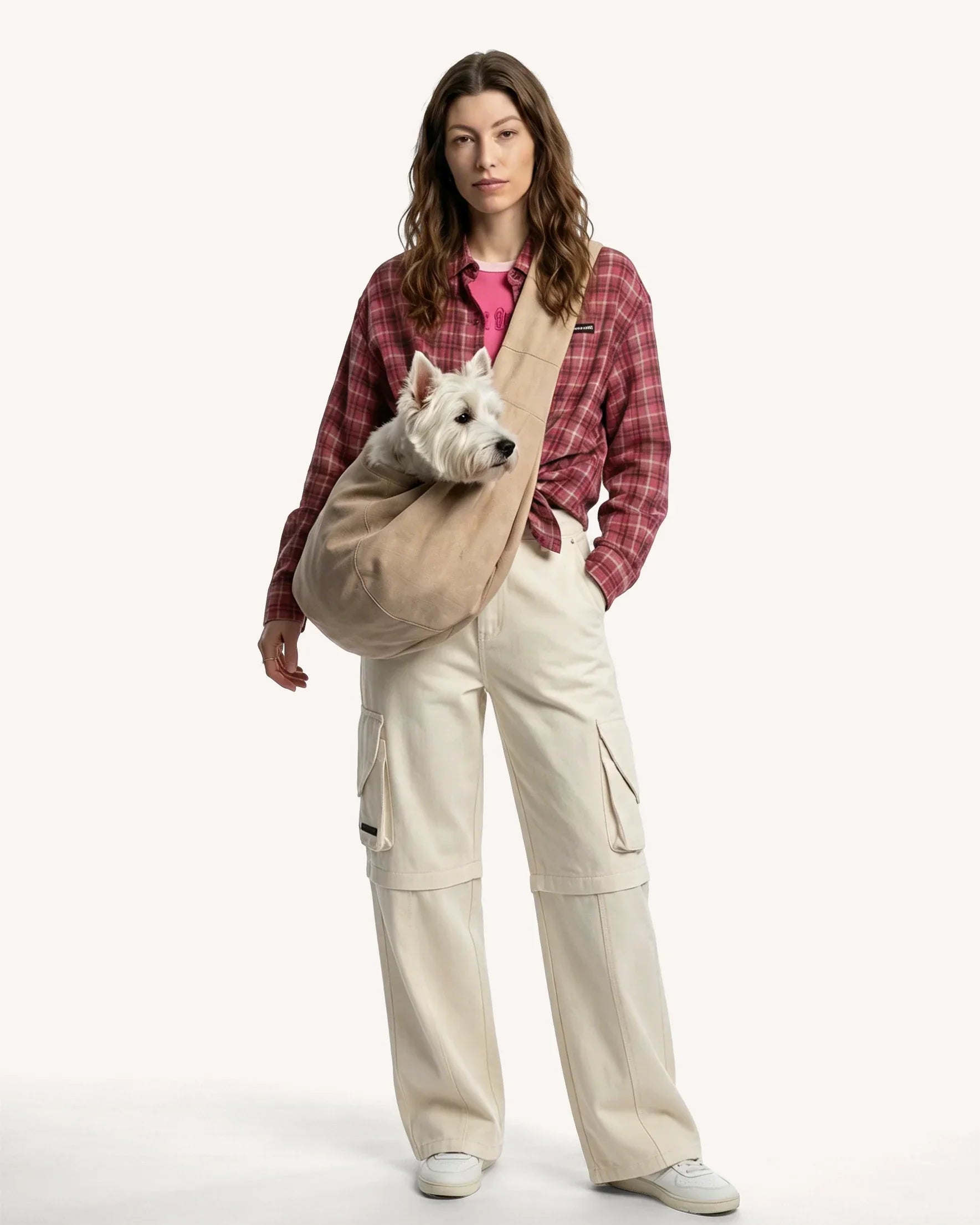 The model carried a West Highland terrier in a cross-body bag.