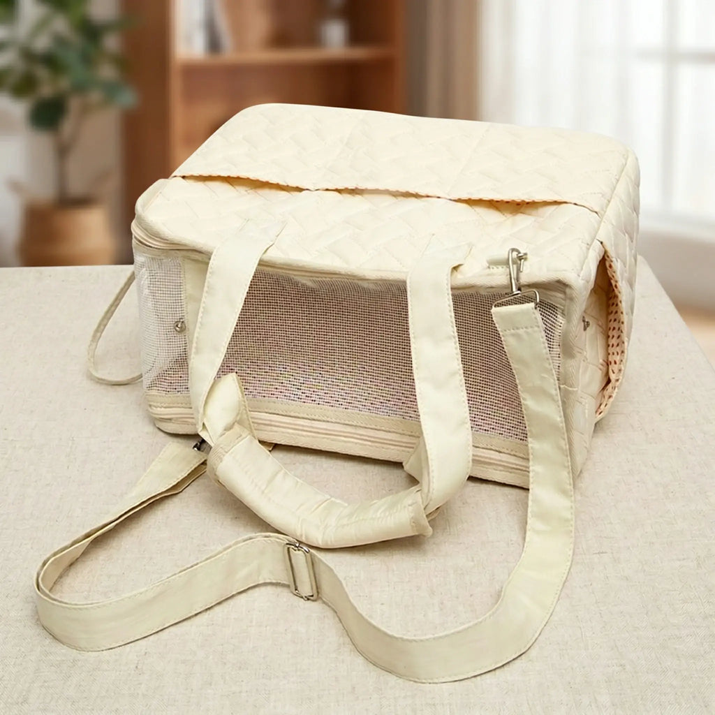 A beige tote bag is placed horizontally on tabletop, featuring a top mesh design