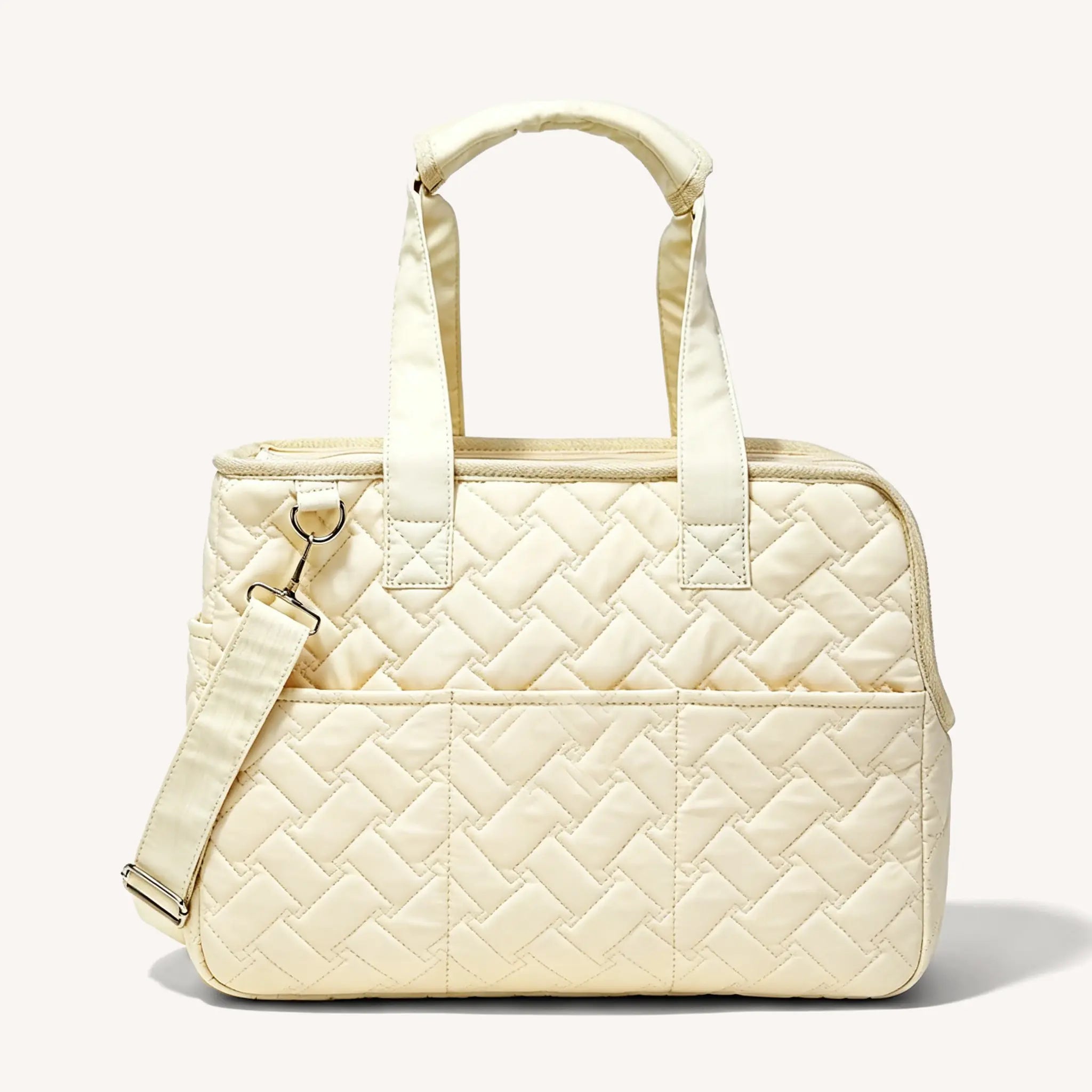 Side view of the beige pet tote bag, featuring a shoulder strap