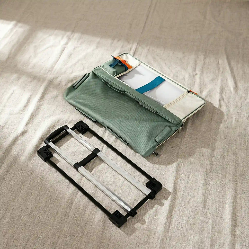 pet stroller is in folded state, with pet carrier and stroller placed separately on the ground